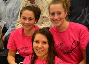 Molly (middle) with friends wearing shirts